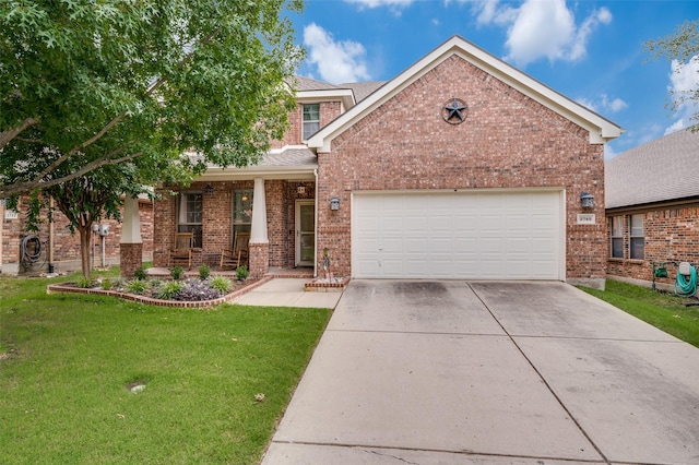 2748 Indian Oak Dr, Mckinney, TX 75071 - view of front of property with brick siding, concrete driveway, a front yard, an attached garage, and covered porch