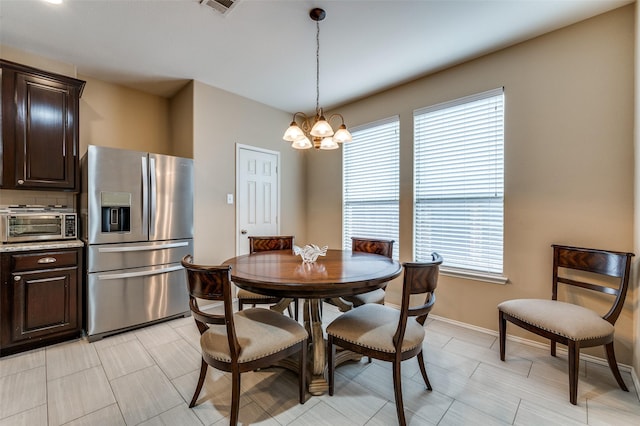 2748 Indian Oak Dr, Mckinney, TX 75071 - dining room featuring a chandelier and plenty of natural light