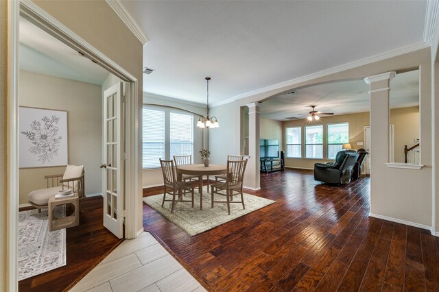 2748 Indian Oak Dr, Mckinney, TX 75071 - dining room with ornate columns, ceiling fan, hardwood / wood-style flooring, crown molding, and arched walkways