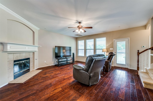 2748 Indian Oak Dr, Mckinney, TX 75071 - living room with stairs, ceiling fan, a fireplace, and wood-type flooring