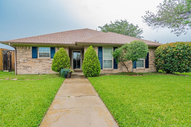 3615 7th St, Sachse, TX 75048 - view of front of property with brick siding, a front lawn, and a shingled roof