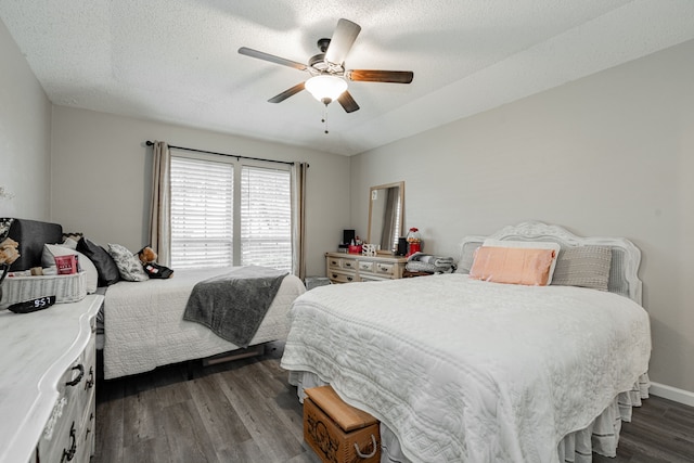 3615 7th St, Sachse, TX 75048 - bedroom with dark wood finished floors, ceiling fan, and a textured ceiling