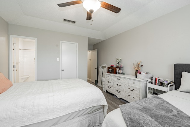 3615 7th St, Sachse, TX 75048 - bedroom with dark wood-style floors, ensuite bathroom, and a ceiling fan
