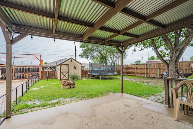 3615 7th St, Sachse, TX 75048 - fenced backyard with a patio area, a trampoline, and a shed