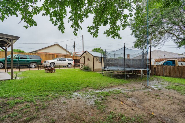 3615 7th St, Sachse, TX 75048 - view of yard with a storage shed and a trampoline