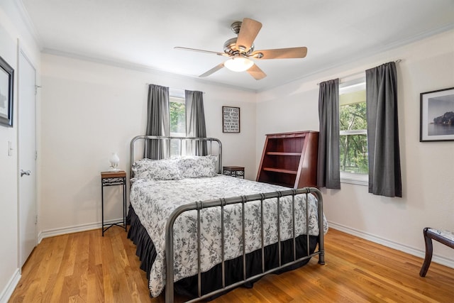 1933 E Hickory Hill Rd, Argyle, TX 76226 - bedroom with crown molding, light wood-style floors, and ceiling fan