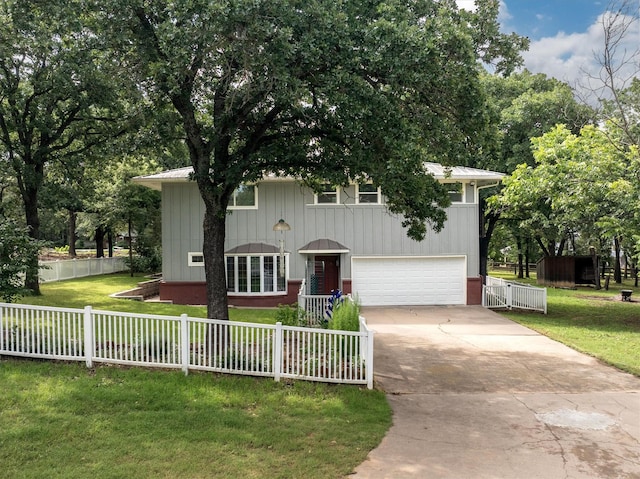 1933 E Hickory Hill Rd, Argyle, TX 76226 - view of front of home with concrete driveway, an attached garage, a metal roof, and board and batten siding