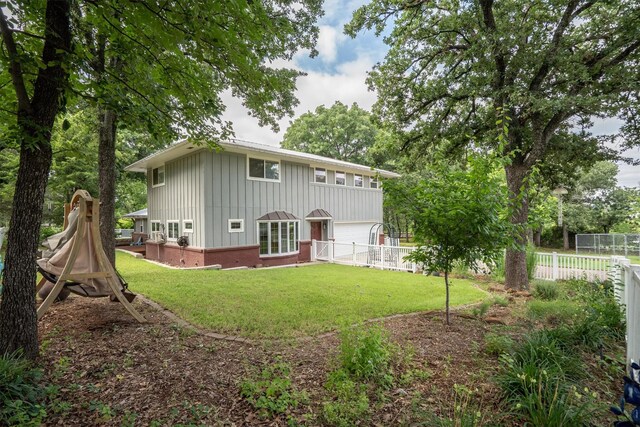 1933 E Hickory Hill Rd, Argyle, TX 76226 - rear view of property with board and batten siding and brick siding