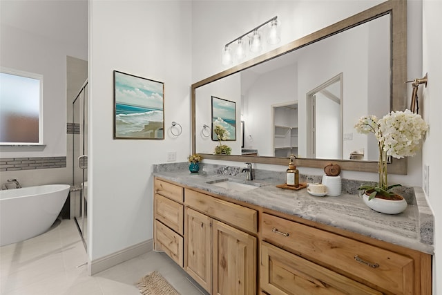 3148 Bryne Ln, Rockwall, TX 75087 - full bath featuring vanity, a soaking tub, tile patterned floors, and a stall shower