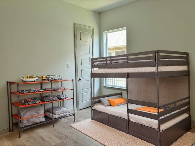 3148 Bryne Ln, Rockwall, TX 75087 - bedroom featuring wood finished floors and multiple windows
