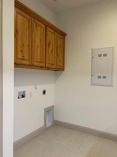3148 Bryne Ln, Rockwall, TX 75087 - laundry room featuring cabinet space, hookup for an electric dryer, gas dryer hookup, electric panel, and washer hookup