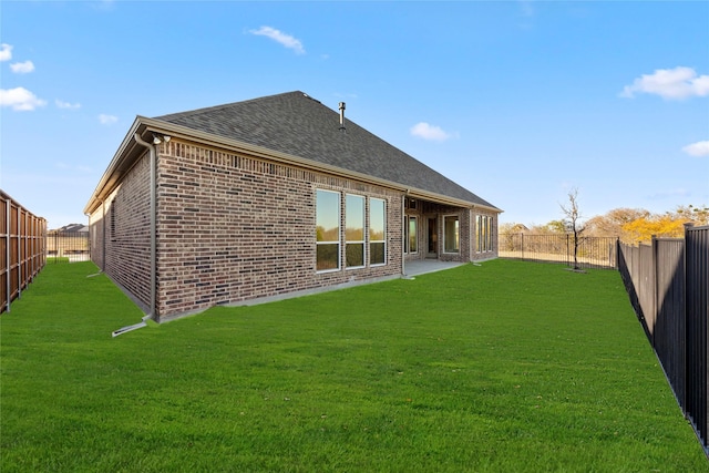 3148 Bryne Ln, Rockwall, TX 75087 - rear view of house featuring brick siding, a fenced backyard, and roof with shingles
