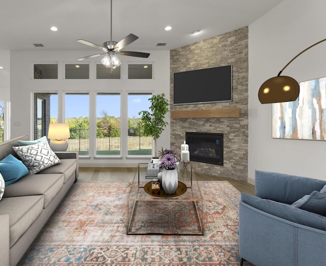 3148 Bryne Ln, Rockwall, TX 75087 - living area with wood finished floors, recessed lighting, ceiling fan, and a fireplace