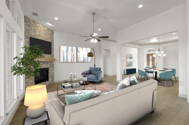 3148 Bryne Ln, Rockwall, TX 75087 - living room with a large fireplace, wood finished floors, a chandelier, recessed lighting, and ceiling fan