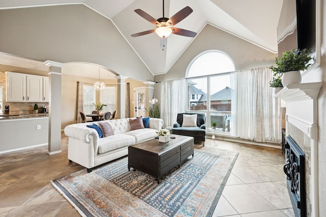 1608 Highland Oaks Dr, Keller, TX 76248 - living area featuring decorative columns, a ceiling fan, high vaulted ceiling, a tiled fireplace, and arched walkways