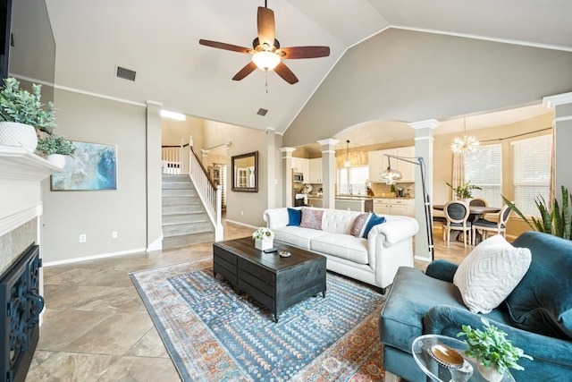 1608 Highland Oaks Dr, Keller, TX 76248 - living area with decorative columns, ceiling fan, high vaulted ceiling, stairs, and a fireplace