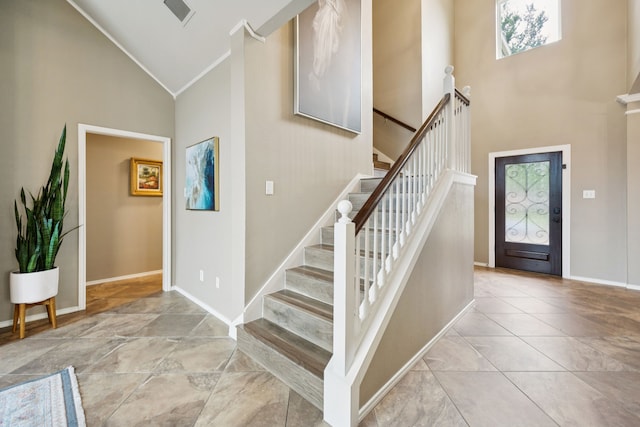 1608 Highland Oaks Dr, Keller, TX 76248 - entryway featuring high vaulted ceiling, stairway, and ornamental molding