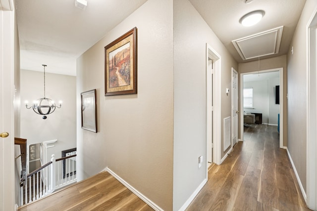 1608 Highland Oaks Dr, Keller, TX 76248 - corridor featuring attic access, wood finished floors, and an upstairs landing