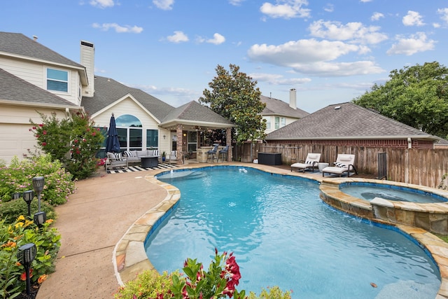 1608 Highland Oaks Dr, Keller, TX 76248 - view of swimming pool featuring a patio, a pool with connected hot tub, and an outdoor hangout area