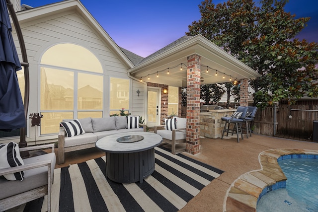 1608 Highland Oaks Dr, Keller, TX 76248 - patio terrace at dusk with an outdoor living space with a fire pit and a patio area