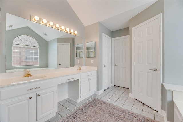 2525 Amber Ln, Flower Mound, TX 75028 - full bath with vaulted ceiling, double vanity, and tile patterned floors