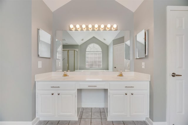 2525 Amber Ln, Flower Mound, TX 75028 - full bathroom featuring lofted ceiling, a shower stall, tile patterned flooring, and double vanity