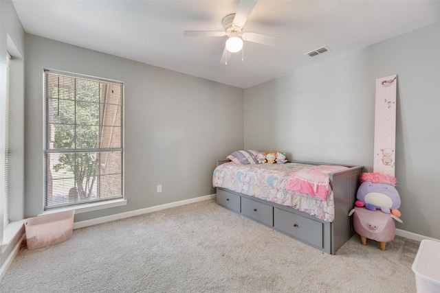 2525 Amber Ln, Flower Mound, TX 75028 - carpeted bedroom with multiple windows and a ceiling fan