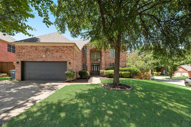 2525 Amber Ln, Flower Mound, TX 75028 - traditional-style home featuring a front lawn, driveway, brick siding, an attached garage, and roof with shingles