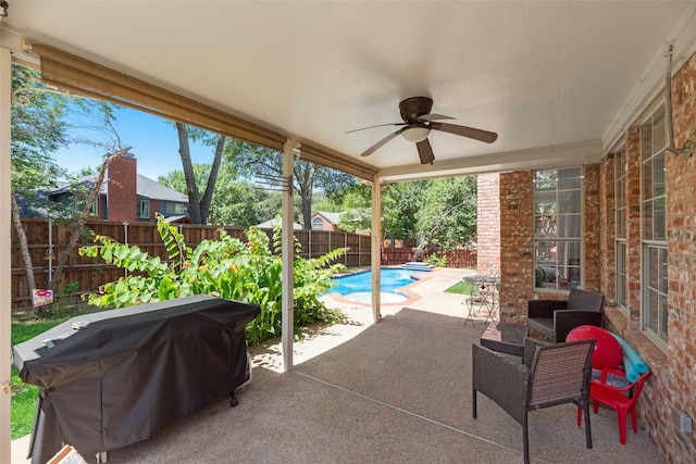 2525 Amber Ln, Flower Mound, TX 75028 - fenced backyard with area for grilling, a patio, and ceiling fan