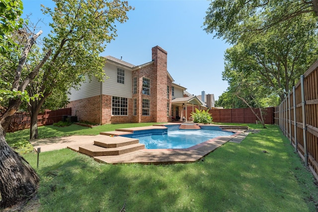 2525 Amber Ln, Flower Mound, TX 75028 - back of property with brick siding, a fenced backyard, a chimney, and a patio