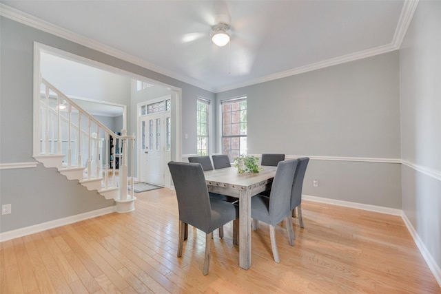 2525 Amber Ln, Flower Mound, TX 75028 - dining room with stairs, ceiling fan, light wood-style flooring, and crown molding