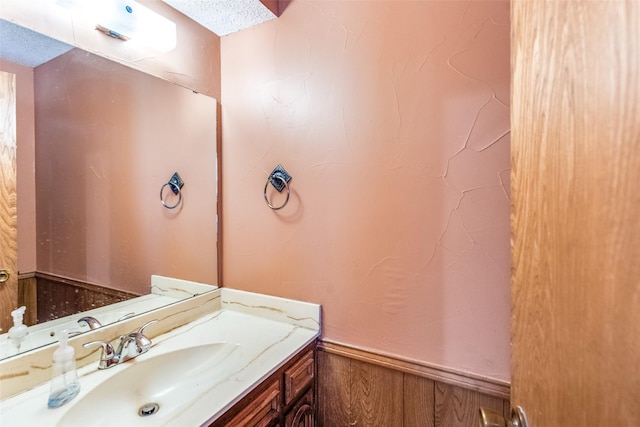 3404 Appalachian Way, Plano, TX 75075 - bathroom featuring vanity and a wainscoted wall