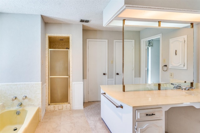 3404 Appalachian Way, Plano, TX 75075 - bathroom with a shower stall, vanity, a garden tub, and a textured ceiling