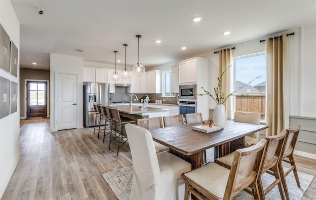 11208 Orchard Ln, Justin, TX 76247 - dining space with light wood-style floors and recessed lighting