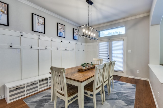 5628 Vineyard Ln, Mckinney, TX 75070 - dining room featuring a chandelier, crown molding, and dark wood-type flooring