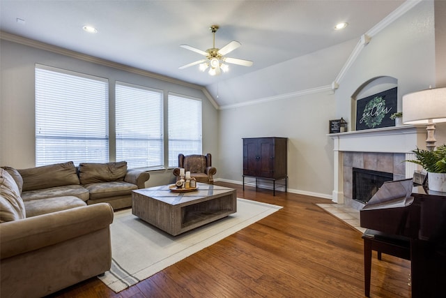 5628 Vineyard Ln, Mckinney, TX 75070 - living area with a ceiling fan, wood finished floors, a fireplace, crown molding, and vaulted ceiling