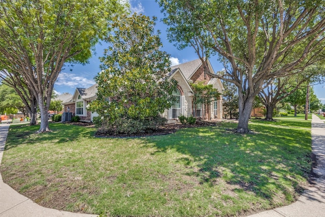 5628 Vineyard Ln, Mckinney, TX 75070 - view of home's exterior featuring brick siding and a lawn