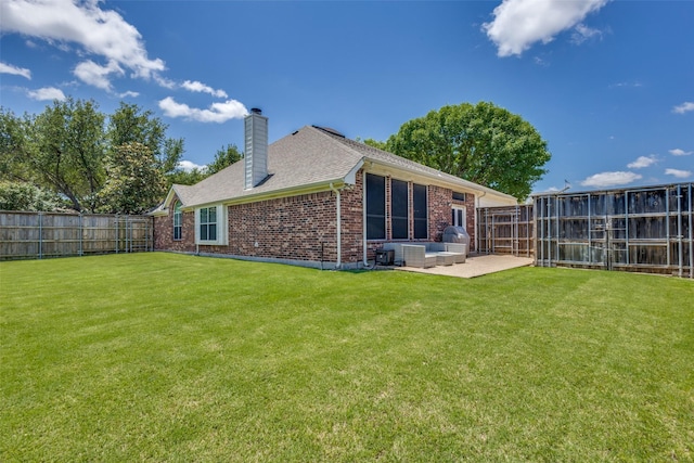 5628 Vineyard Ln, Mckinney, TX 75070 - back of property with brick siding, a chimney, a patio, a fenced backyard, and a shingled roof