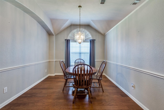 5628 Vineyard Ln, Mckinney, TX 75070 - dining space with wood finished floors, a chandelier, lofted ceiling, arched walkways, and a textured wall
