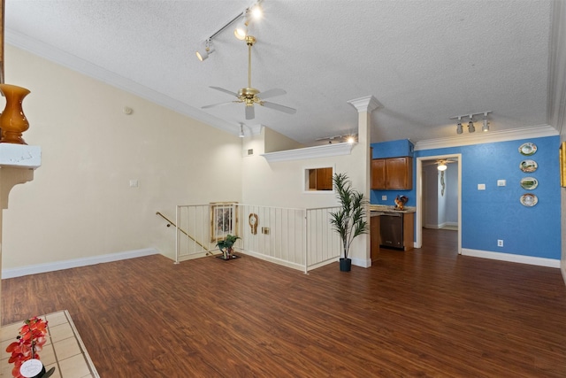 6503 Ridgecrest Rd Unit 107G, Dallas, TX 75231 - unfurnished living room featuring rail lighting, ceiling fan, a textured ceiling, dark wood finished floors, and crown molding