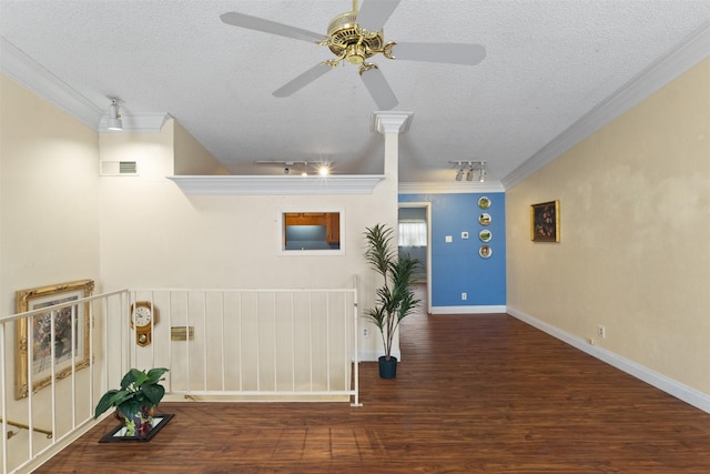 6503 Ridgecrest Rd Unit 107G, Dallas, TX 75231 - hallway with crown molding, a textured ceiling, and wood finished floors
