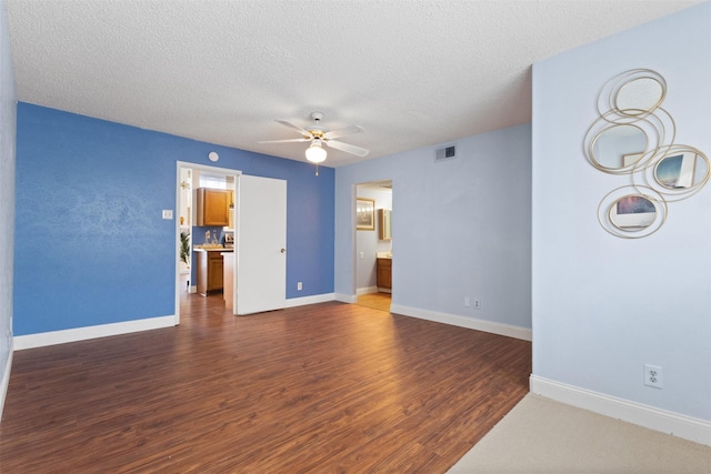 6503 Ridgecrest Rd Unit 107G, Dallas, TX 75231 - empty room with a ceiling fan, dark wood-style floors, and a textured ceiling