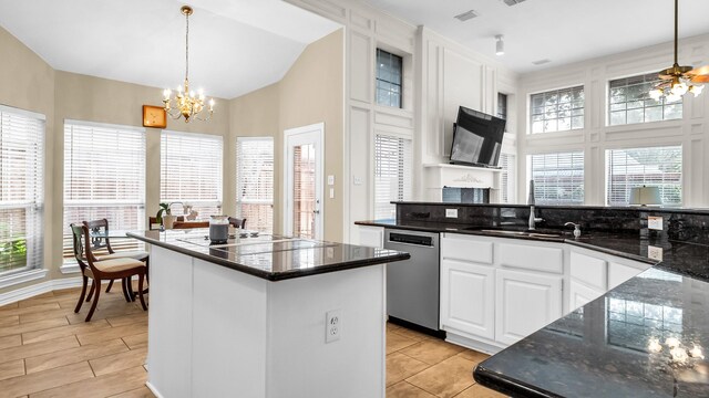 6740 Magnum Dr, Plano, TX 75024 - kitchen featuring dishwasher, a center island, a chandelier, white cabinetry, and hanging light fixtures