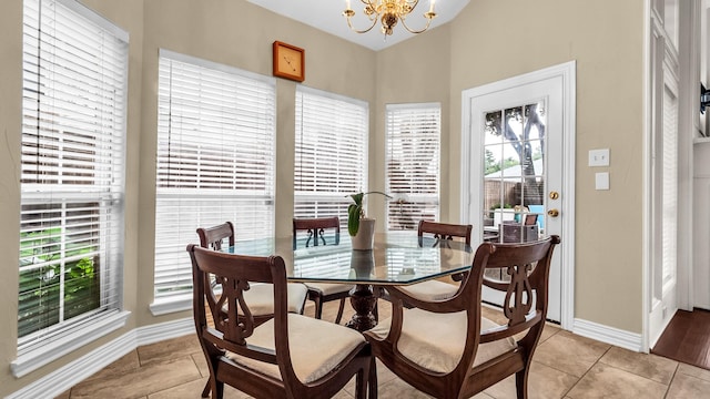 6740 Magnum Dr, Plano, TX 75024 - dining room featuring a chandelier and light tile patterned floors