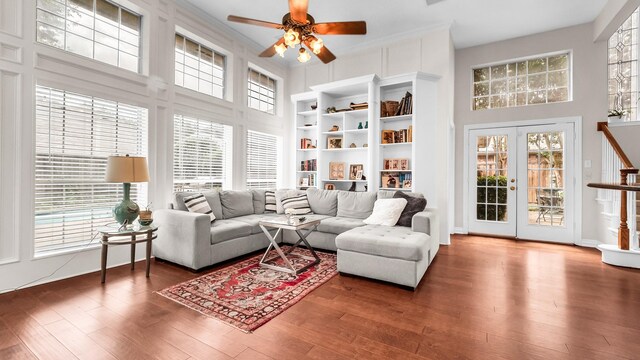 6740 Magnum Dr, Plano, TX 75024 - living room with ceiling fan, wood finished floors, and a high ceiling