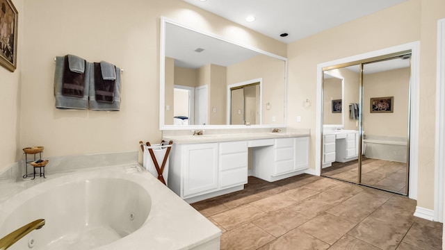 6740 Magnum Dr, Plano, TX 75024 - full bath featuring double vanity, a whirlpool tub, and recessed lighting