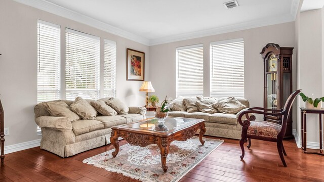 6740 Magnum Dr, Plano, TX 75024 - living room featuring healthy amount of natural light, ornamental molding, and hardwood / wood-style flooring