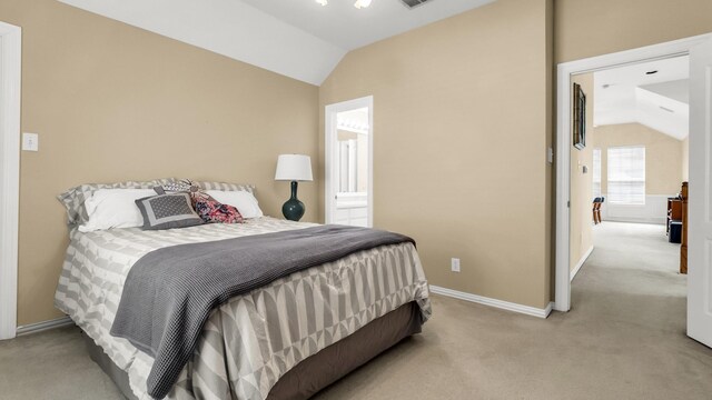 6740 Magnum Dr, Plano, TX 75024 - carpeted bedroom with lofted ceiling and ensuite bath