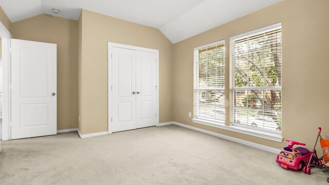 6740 Magnum Dr, Plano, TX 75024 - unfurnished bedroom featuring vaulted ceiling, carpet floors, and a closet