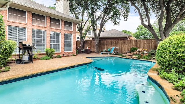 6740 Magnum Dr, Plano, TX 75024 - view of swimming pool with grilling area and a patio